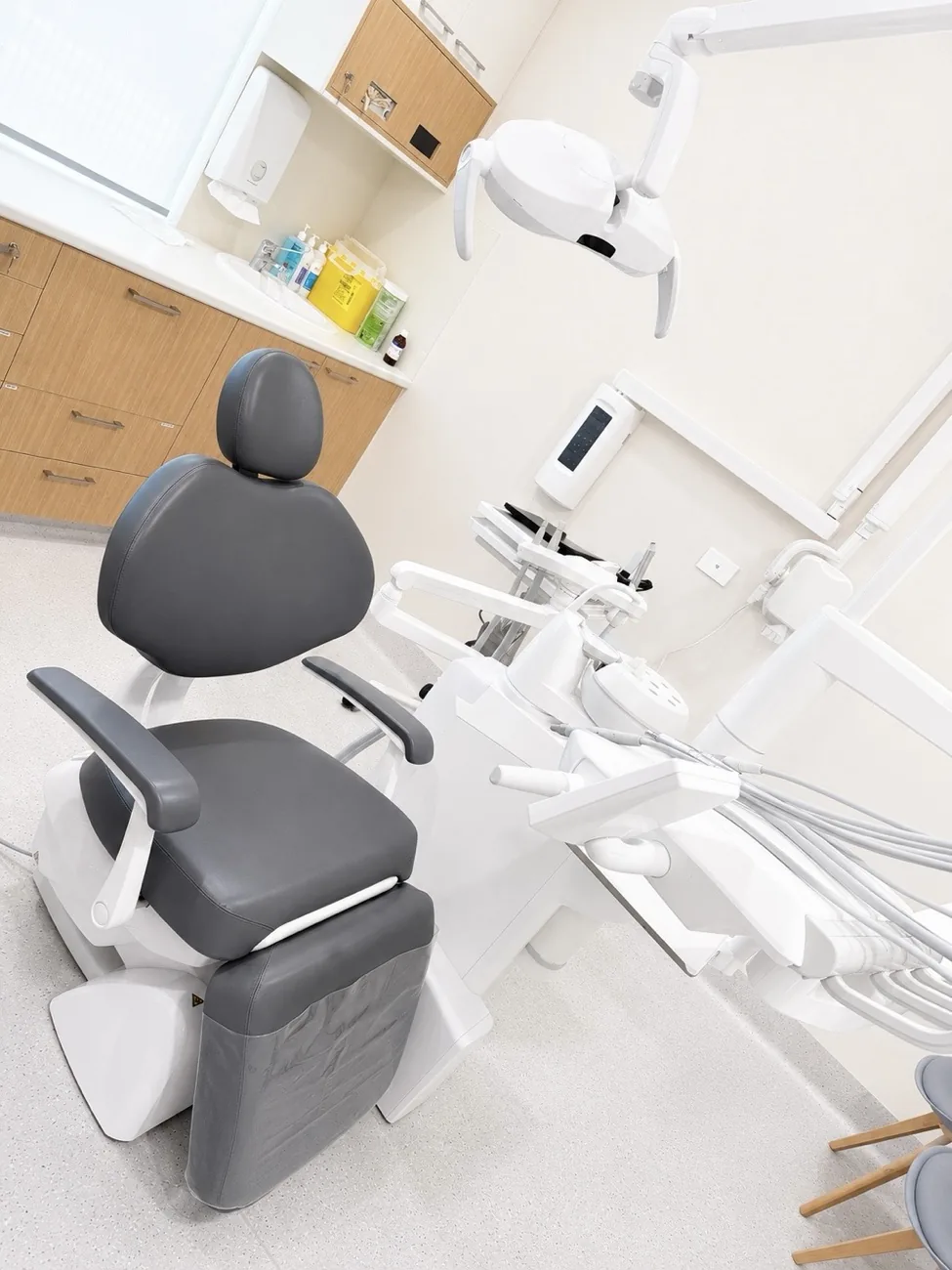 Treatment room with oak detailing at Allura Dental